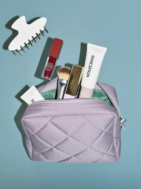 Bag and accessories product photography: cosmetic pouch bursting open