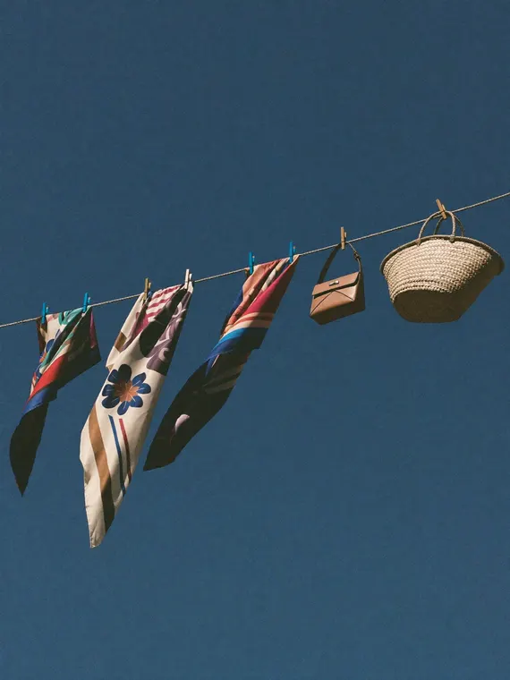 Bag and accessories product photography: silk scarves, clothesline with the basket