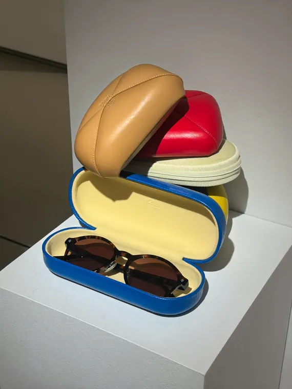 Bag and accessories product photography: sunglasses cases stacked on the plinth
