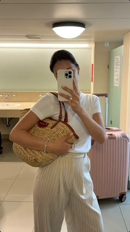 Bag AI UGC reel: airport, bathroom mirror selfie