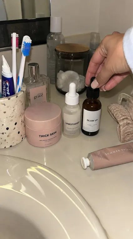 Beauty AI UGC reel: bathroom shelf, THICK SKIN and UNBOTHERED