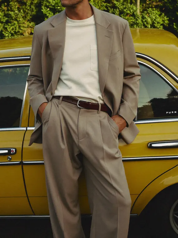 AI fashion model shoot: menswear, beige suit and the yellow car