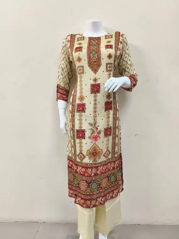 Product photo of a cream embroidered kurta set, the one photo the festive film was made from
