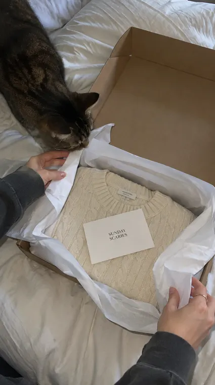 Fashion AI UGC reel: unboxing, knit sweater parcel