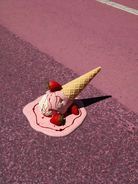 Food and beverage product photography: ice cream, cone melting on pink asphalt