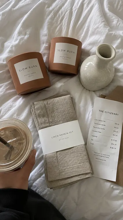 Home decor AI UGC reel: haul, SLOW BURN candles on the bed