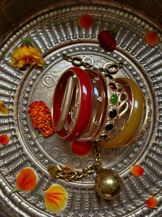 Jewellery product photography: bangles stacked on the brass lota