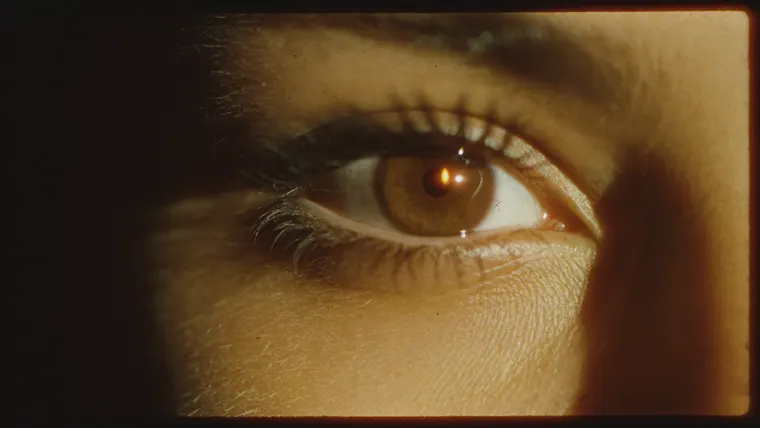 Perfume ad film The Last Light, scene 3: eye with candle flames