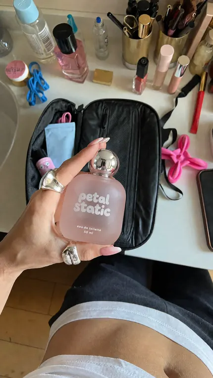 Perfume AI UGC reel: Petal Static, bathroom counter
