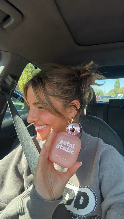 Perfume AI UGC reel: Petal Static, car passenger seat