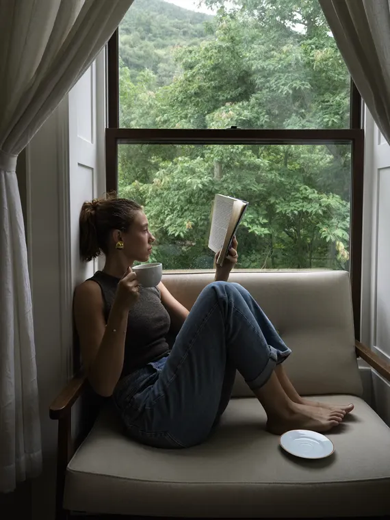 Lifestyle property shoot: lifestyle, reading in the window seat