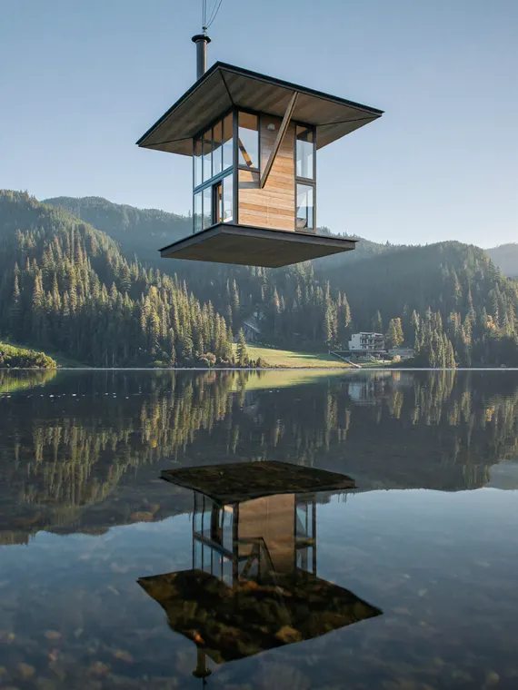 3D architectural render: upside down house over the lake