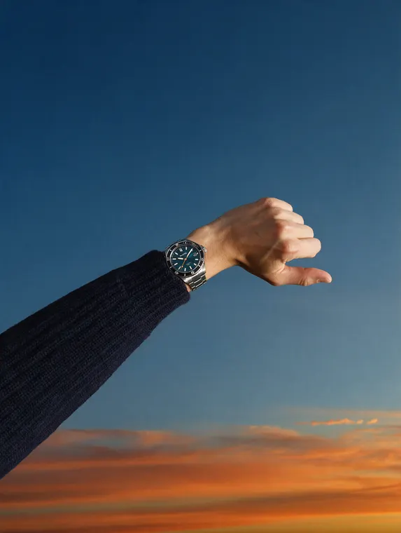 Watch model shoot: Halden Tidemark, wrist against the dusk sky